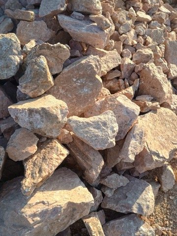 Soda feldspar lumps ready for export at Rajasthan stockyard