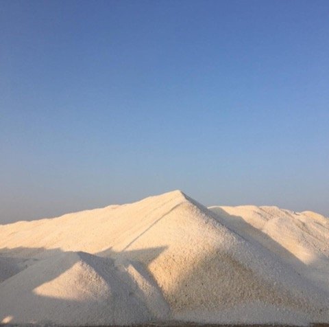 White industrial salt mountain at salt works