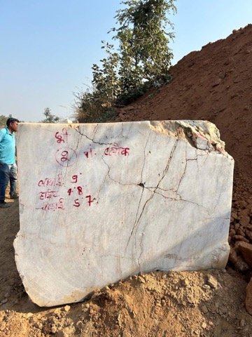 Team inspecting dressed blocks at quarry